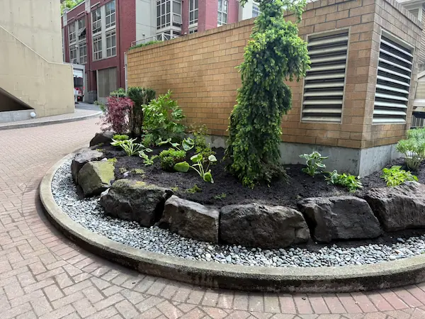 Strata garden design featuring elegant paving, landscaped greenery, and well-maintained communal outdoor spaces.